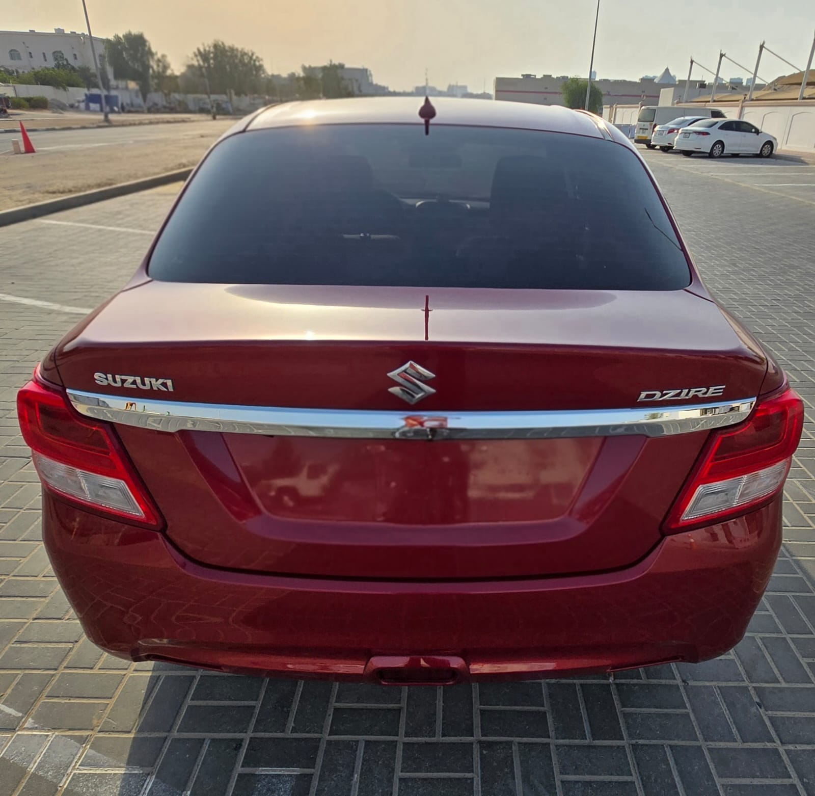 Red Suzuki Dzire GL 2023