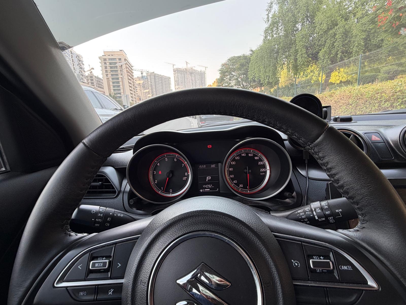 Red Suzuki Swift GLX 2024