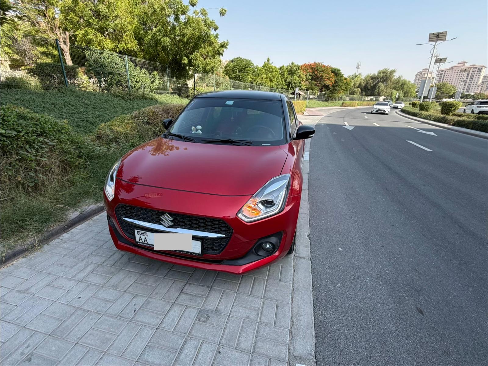 Red Suzuki Swift GLX 2024