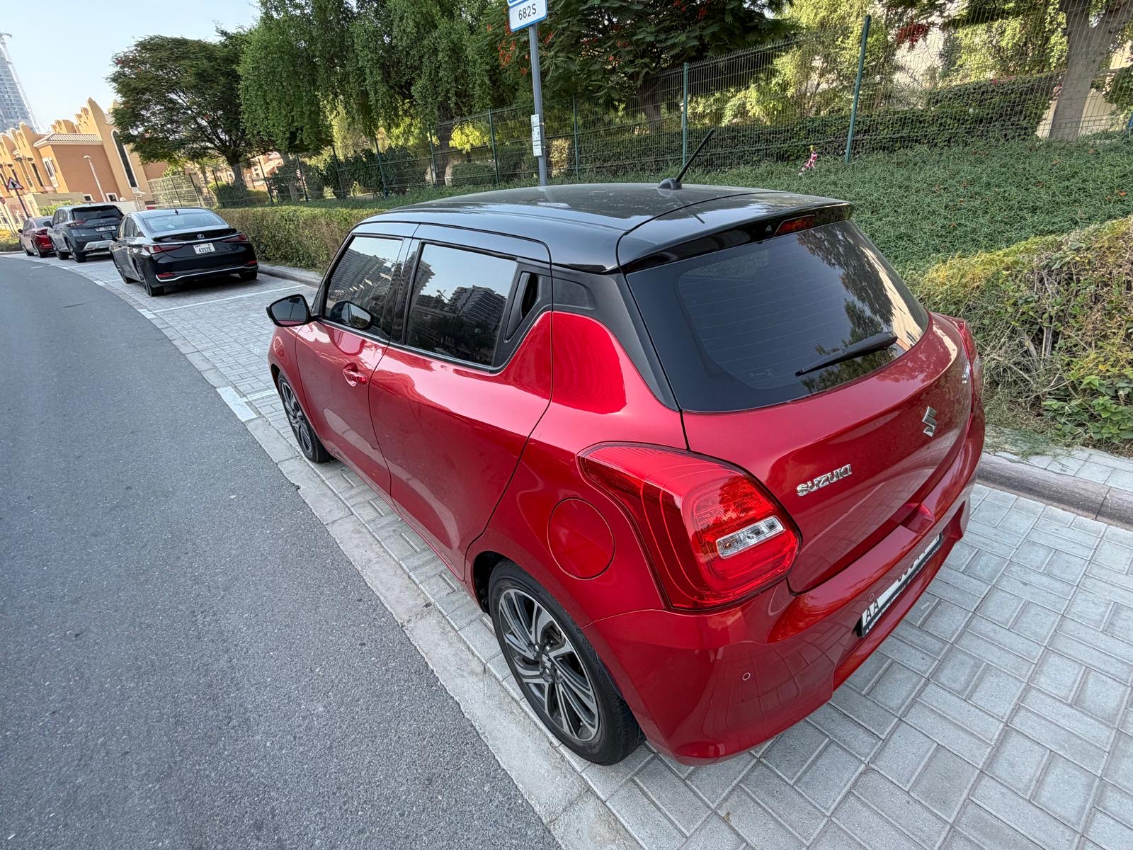 Red Suzuki Swift GLX 2024