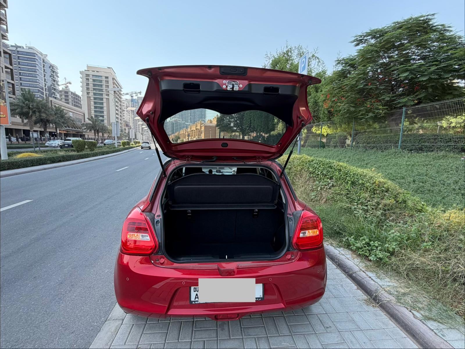 Red Suzuki Swift GLX 2024