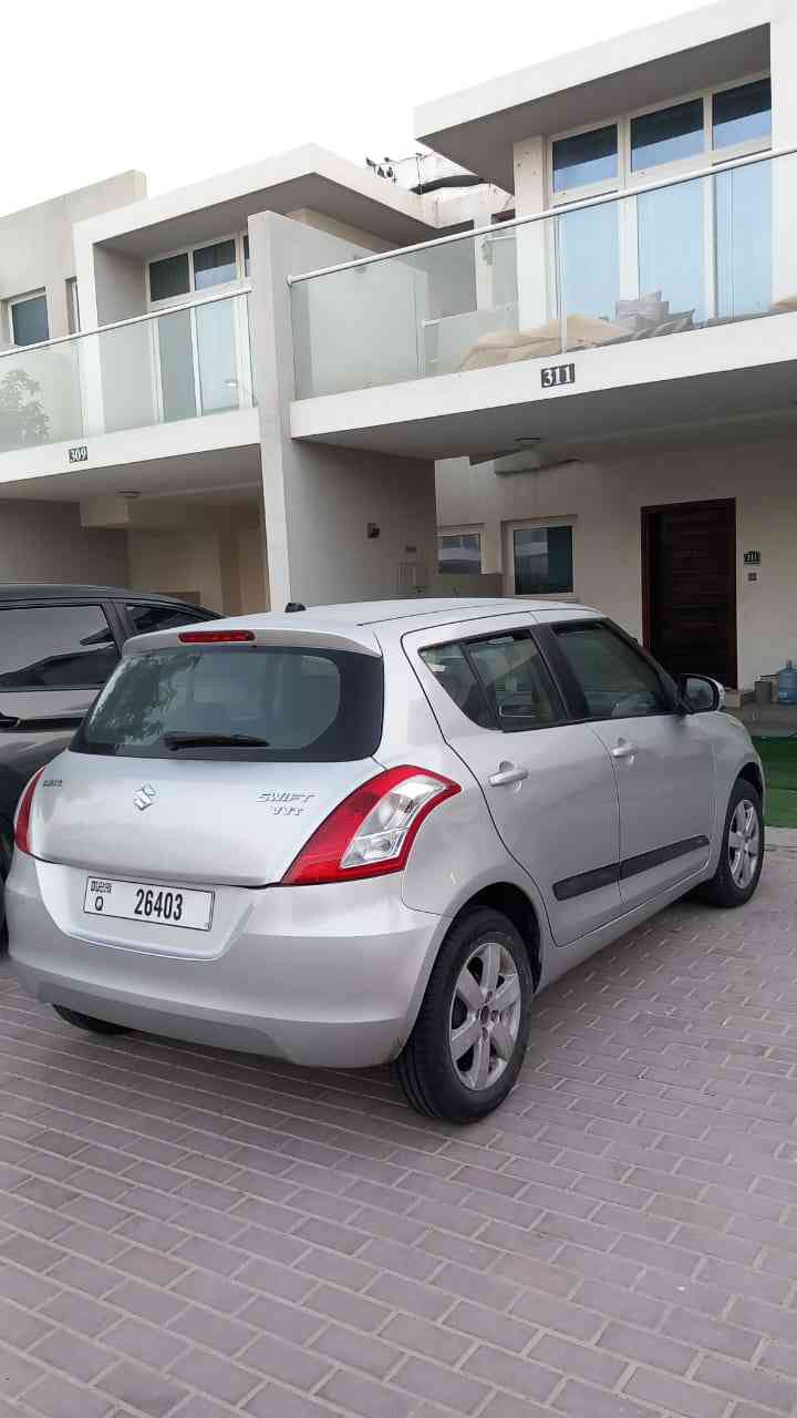 Silver Suzuki Swift GL 2015