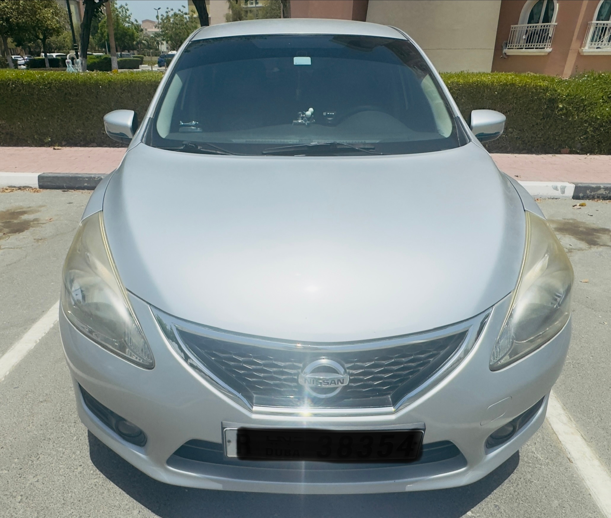 Silver Nissan Tiida 2014