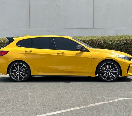 Yellow BMW M135i 2022