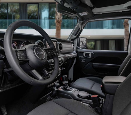White Jeep Wrangler Sport 2023