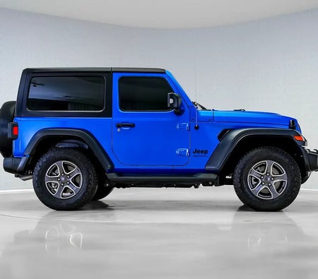 Голубой Jeep Wrangler Sport 2023 год Голубой Jeep Wrangler Sport 2023 год