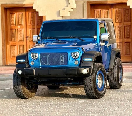 Голубой Jeep Wrangler Sport 2015 год