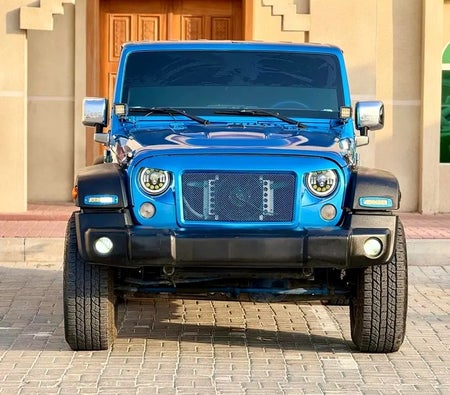 Голубой Jeep Wrangler Sport 2015 год