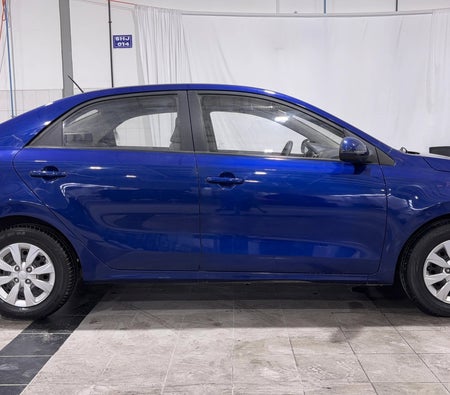 Blue Kia Pegas LX 2024