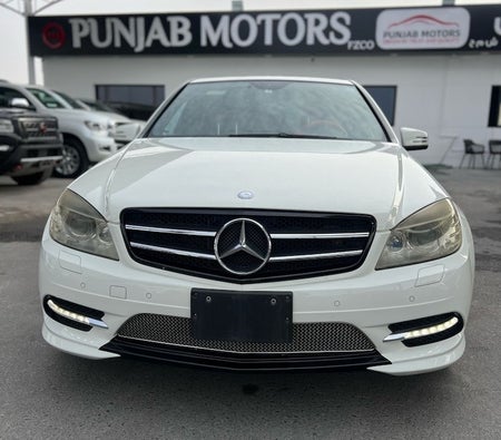 White Mercedes Benz AMG C63 2007