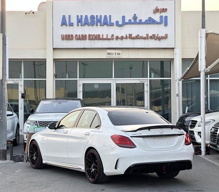 White Mercedes Benz C63 AMG 2015