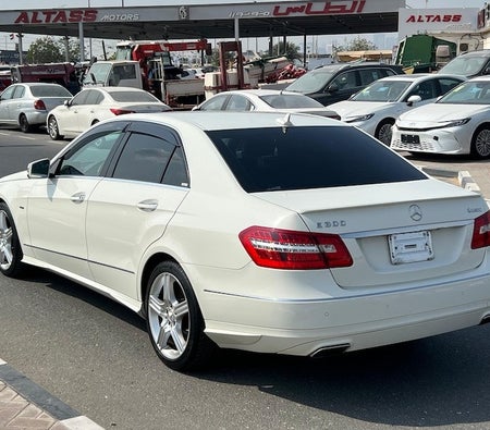 White Mercedes Benz E300 2012