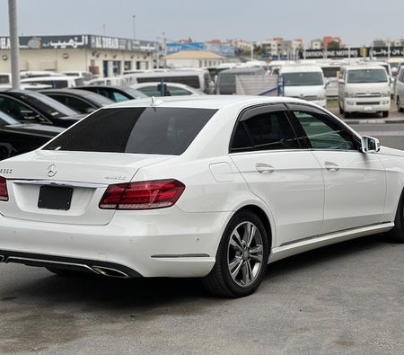 White Mercedes Benz E300 2014