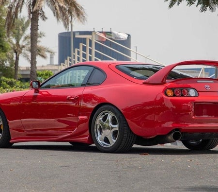 Red Toyota Supra 1995