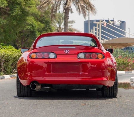 Red Toyota Supra 1995