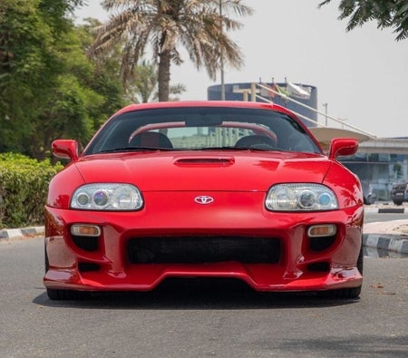 Red Toyota Supra 1995