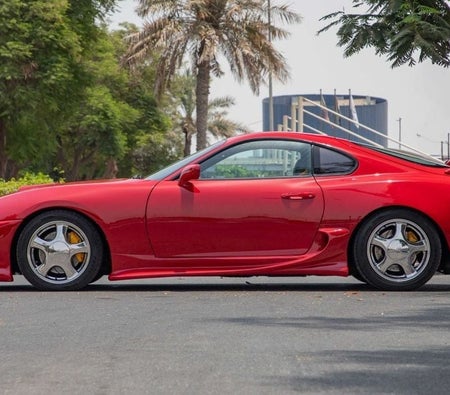 Red Toyota Supra 1995