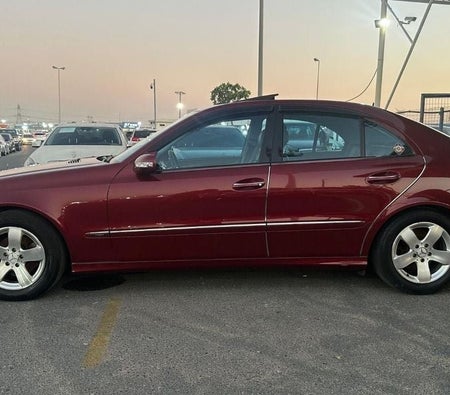 Red Mercedes Benz E320 2003
