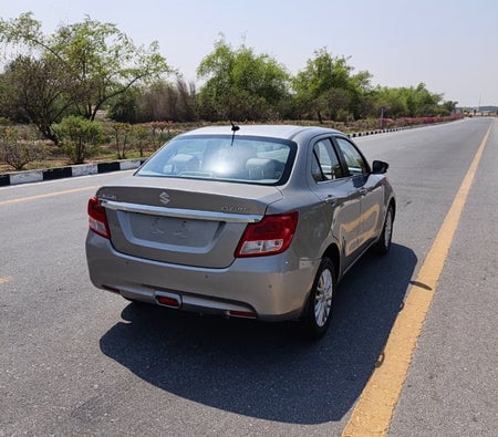 Silver Suzuki Dzire 2023