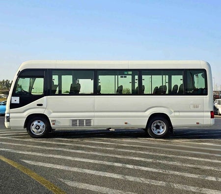 Blanc Toyota Coaster 2025