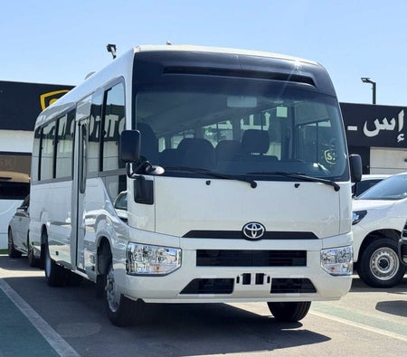 Blanc Toyota Coaster 2026